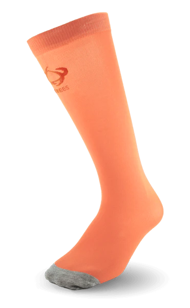 Ultra-thin Thinees skating socks in Coral. Sleek and breathable material designed for figure and hockey skaters