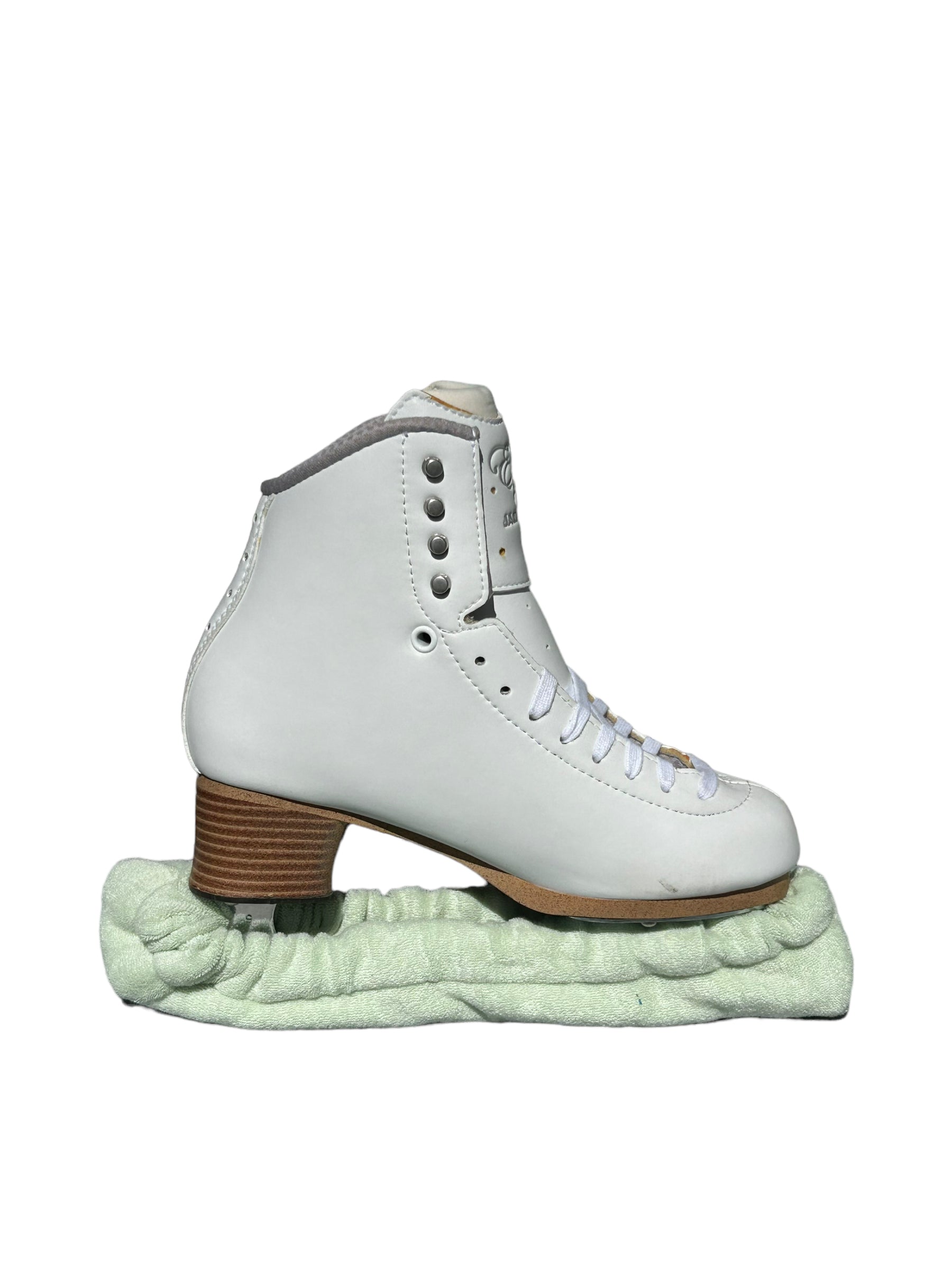 A pair of Skating Eleganza Terry Soakers in soft terry cloth fabric, shown covering skate blades to prevent rust and damage. Light Green.